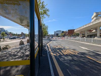 One of the bus stands at the temporary bus station with road markings on the ground