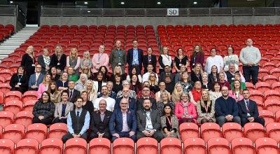 A group of adult social care staff with at the front Director for Finance Richard Gibson, Chief Executive Mark Palethorpe, Councillor Andy Bowden, Cabinet Member for Health and Social Care, Council Leader Councillor Anthony Burns ad Executive Director for