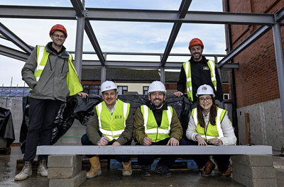 L-R: Mike Smith, HH Smith, Matt Whiteley, Muse, David Baines MP, Councillor Kate Groucutt, St Helens Borough Council and Padraig O'Neill, HH Smith at steel signing in Earlestown Town Hall