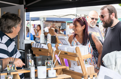 People at a market stall at an Independent Street Market