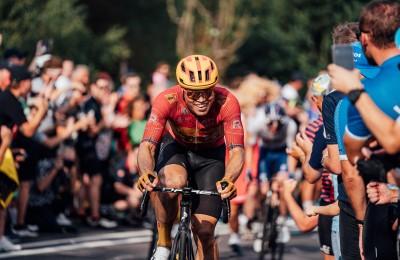 A cyclist racing through the crowds at the Tour de France