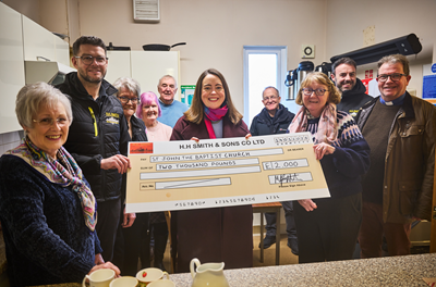 Councillor Kate Groucutt, Mike Smith and Padraig O'Neill from HH Smith, Reverend Tim Griffiths and volunteers during donation to St John the Baptist Church in Earlestown
